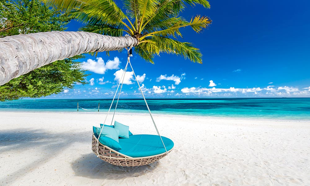 viaggio di nozze maldive oceano indiano mare palme spiaggia sabbia bianca amaca dondolo per due 1
